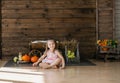 Cute little girl in autumn decoration. Halloween. Studio shot