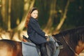 Cute little girl in a autumn field with horse Royalty Free Stock Photo