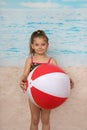 Cute little girl on beach with ball Royalty Free Stock Photo