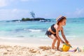 Adorable little girl have fun at tropical beach during vacation Royalty Free Stock Photo