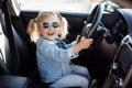 Little girl in the driver`s seat driving a car Royalty Free Stock Photo