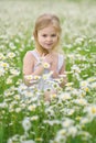 Little girl in camomile meadow Royalty Free Stock Photo