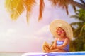 Cute little girl in big hat on summer beach Royalty Free Stock Photo