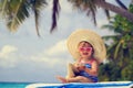 Cute little girl in big hat on summer beach Royalty Free Stock Photo