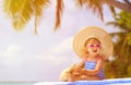 Cute little girl in big hat on summer beach Royalty Free Stock Photo