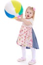 Cute little girl with big inflatable ball Royalty Free Stock Photo