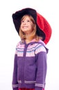 Cute little girl with big red wizards hat smiling Royalty Free Stock Photo