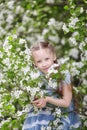 Cute little girl in blooming apple tree garden at spring Royalty Free Stock Photo