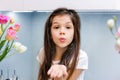 Cute little girl blowing kisses away Royalty Free Stock Photo