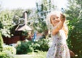 Cute little girl is blowing a soap bubbles and having fun Royalty Free Stock Photo
