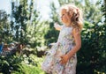 Cute little girl is blowing a soap bubbles and having fun Royalty Free Stock Photo