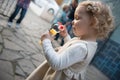 Cute little girl blowing soap bubbles Royalty Free Stock Photo