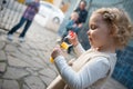 Cute little girl blowing soap bubbles Royalty Free Stock Photo