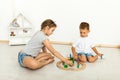 Cute little girl and boy playing with toys by the home Royalty Free Stock Photo