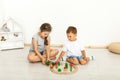 Cute little girl and boy playing with toys by the home Royalty Free Stock Photo