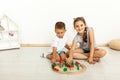 Cute little girl and boy playing with toys by the home Royalty Free Stock Photo