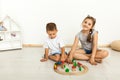 Cute little girl and boy playing with toys by the home Royalty Free Stock Photo