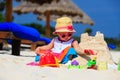 Cute little girl building sandcastle on summer Royalty Free Stock Photo