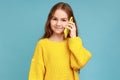 Cute little girl calling on cell phone, good cellular, comfortable to use children mobile device. Royalty Free Stock Photo