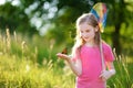 Cute little girl catching butterflies and bugs with her scoop-net Royalty Free Stock Photo