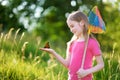 Cute little girl catching butterflies and bugs with her scoop-net Royalty Free Stock Photo