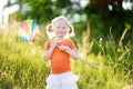 Cute little girl catching butterflies and bugs with her scoop-net Royalty Free Stock Photo