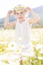 Cute little girl in the chamomile field Royalty Free Stock Photo