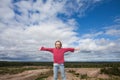 Cute little girl child against sky clouds outdoor Royalty Free Stock Photo