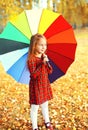 Cute little girl child with colorful umbrella in sunny autumn da Royalty Free Stock Photo