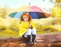 Cute little girl child with colorful umbrella Royalty Free Stock Photo
