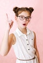 Cute little girl child preteen in eyeglasses with finger up education, school and vision concept isolated Royalty Free Stock Photo