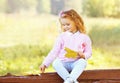 Cute little girl child with yellow maple leafs in autumn Royalty Free Stock Photo