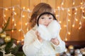 Cute little girl and christmas decor, beautiful light