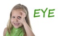 Cute little girl circling eye in body parts learning English words at school Royalty Free Stock Photo