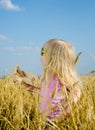 Cute little girl in a colorful hat and sunglasses Royalty Free Stock Photo