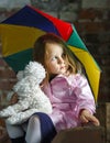 Cute little girl with colorful umbrella Royalty Free Stock Photo