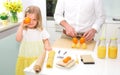 Cute little girl cooking in the kitchen.