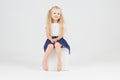 Cute little girl on cube Royalty Free Stock Photo