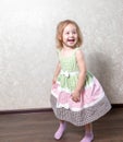 Cute little girl dancing, spinning in a dance, laughing Royalty Free Stock Photo