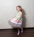 Cute little girl dancing, spinning in a dance, laughing Royalty Free Stock Photo