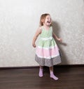 Cute little girl dancing, spinning in a dance, laughing Royalty Free Stock Photo