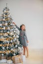 Cute little girl decorating christmas tree. Royalty Free Stock Photo