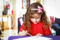 Cute little girl doing her homework Royalty Free Stock Photo