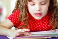 Cute little girl doing her homework Royalty Free Stock Photo