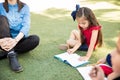 Little girl enjoying a class outdoors