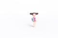 Cute little girl doll in pink swimsuite isolate on white background Royalty Free Stock Photo