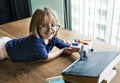 Cute little girl drawing on a blackboard Royalty Free Stock Photo