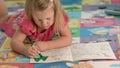 Cute little girl is drawing with felt-tip pen Royalty Free Stock Photo