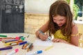 Cute little girl drawing and painting at kindergarten. Creative activities kids club Royalty Free Stock Photo