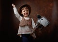 Cute little girl dressed like a cowboy playing with a homemade h Royalty Free Stock Photo